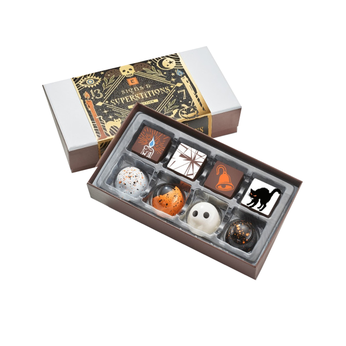 Christopher Elbow Signs and Superstitions 8-piece chocolate collection with black and gold illustrated gift sleeve and Halloween bonbons