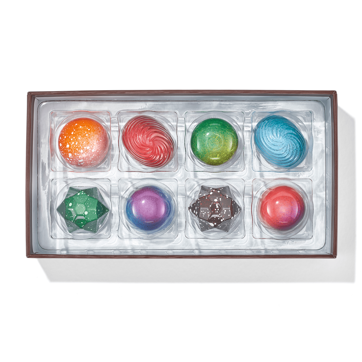 Eight colorful Christopher Elbow artisan chocolates