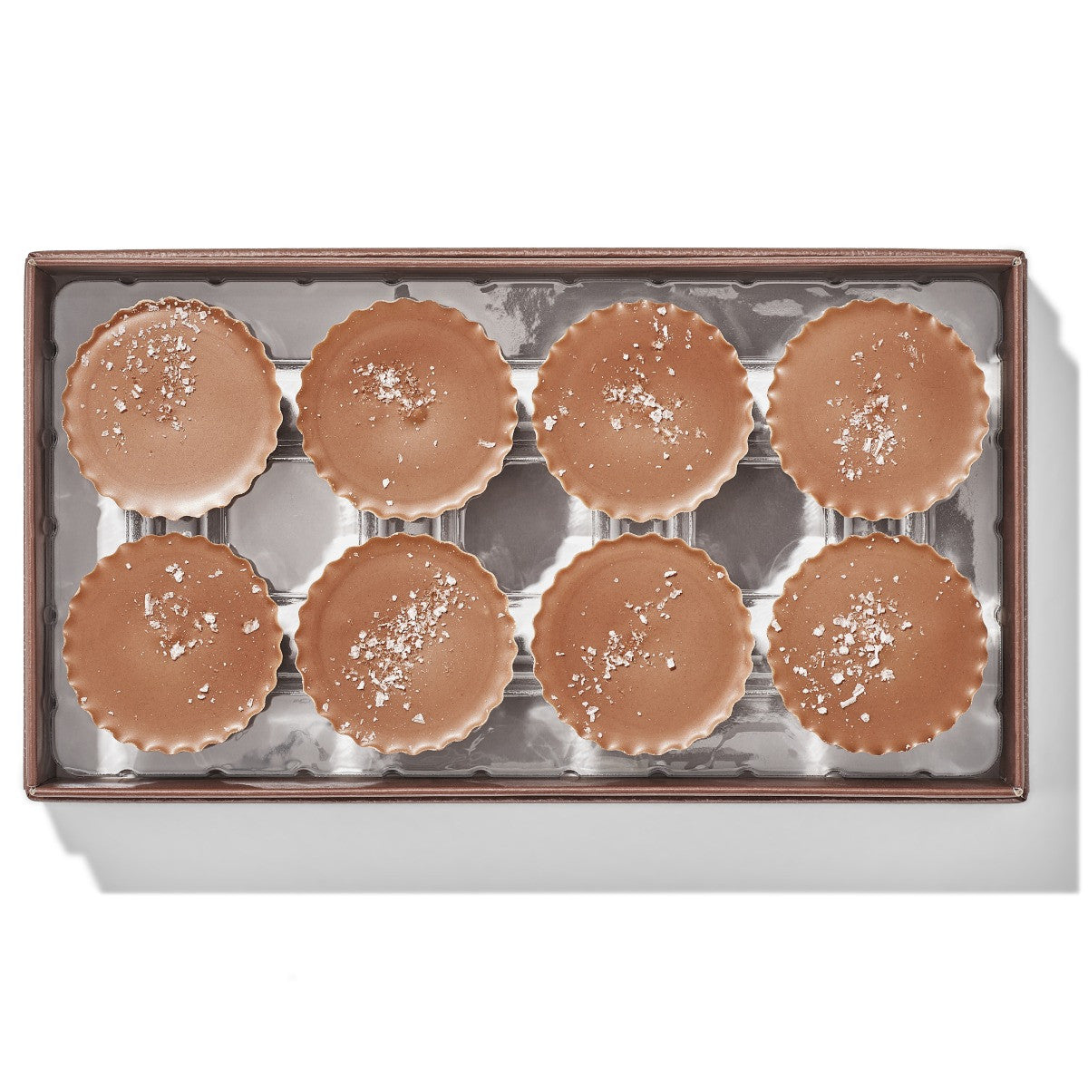 Eight Christopher Elbow milk chocolate peanut butter cups with sea salt