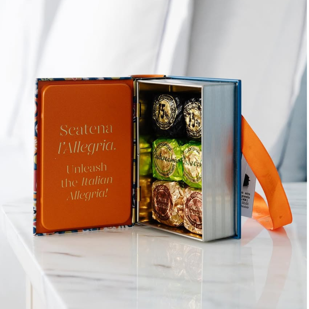 Six Venchi Chocoviar chocolates in a colorful gift box